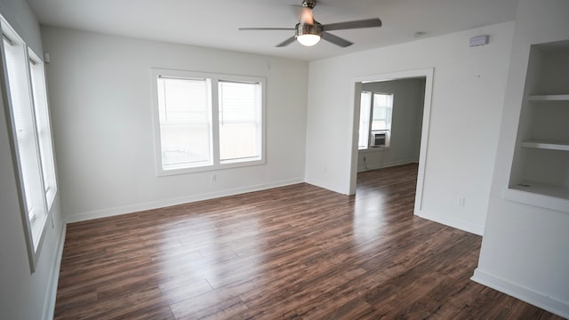 1126 Ryon St, Houston, TX 77009 - spare room featuring ceiling fan, dark wood-style flooring, built in features, and baseboards
