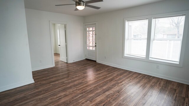 1126 Ryon St, Houston, TX 77009 - spare room featuring a ceiling fan, dark wood-style flooring, and baseboards