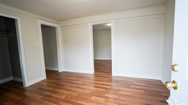 1126 Ryon St, Houston, TX 77009 - unfurnished bedroom with wood finished floors, baseboards, and a closet