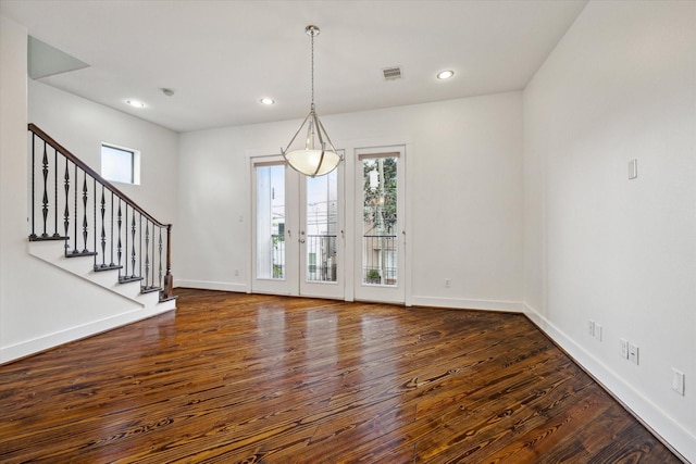 5714 Kansas St, Houston, TX 77007 - spare room with wood finished floors, baseboards, stairs, and recessed lighting