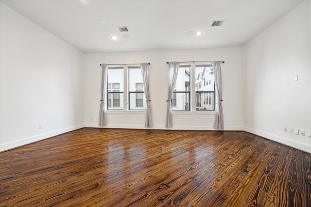 5714 Kansas St, Houston, TX 77007 - unfurnished room with wood finished floors, baseboards, and recessed lighting