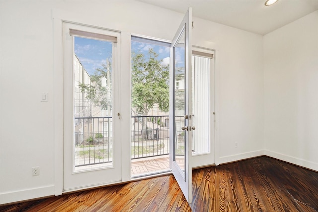 5714 Kansas St, Houston, TX 77007 - doorway featuring wood finished floors, baseboards, and recessed lighting