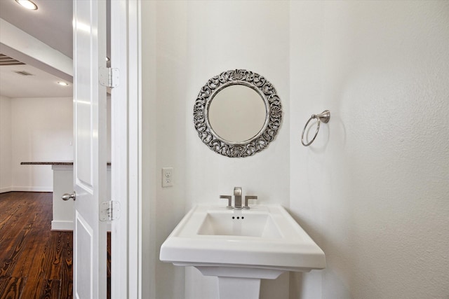 5714 Kansas St, Houston, TX 77007 - bathroom featuring wood finished floors, recessed lighting, baseboards, and a sink