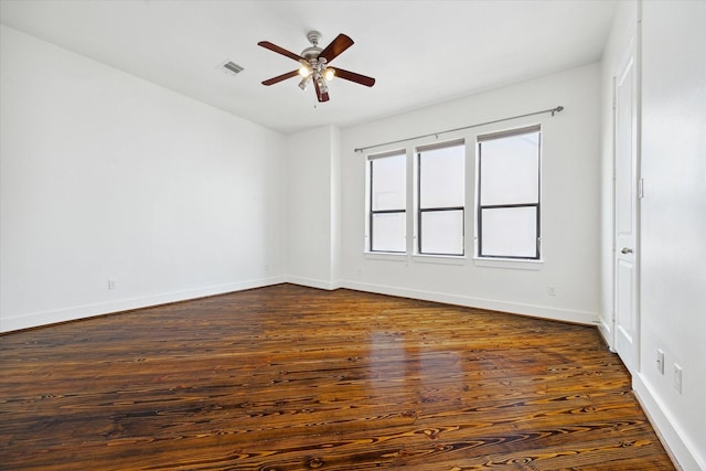5714 Kansas St, Houston, TX 77007 - unfurnished room with ceiling fan, dark wood-style flooring, and baseboards