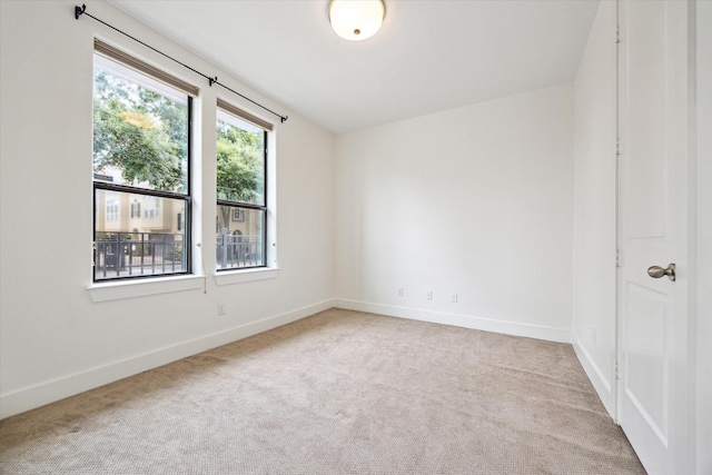 5714 Kansas St, Houston, TX 77007 - carpeted empty room featuring baseboards