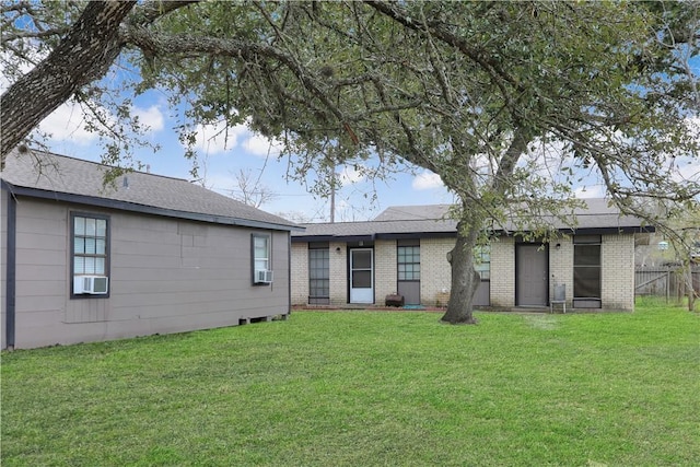 1916 Holloman Dr, Port Lavaca, TX 77979 - back of property featuring brick siding and cooling unit