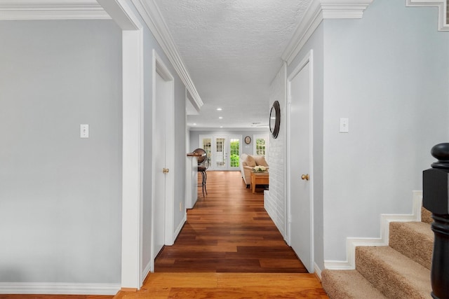 11723 Quail Creek Dr, Houston, TX 77070 - corridor with light wood-style flooring, stairs, baseboards, and a textured ceiling