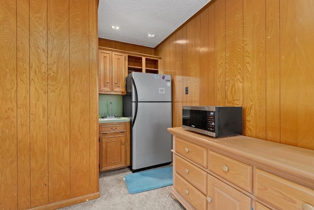 11723 Quail Creek Dr, Houston, TX 77070 - kitchen featuring stainless steel appliances, light carpet, open shelves, light countertops, and wood walls