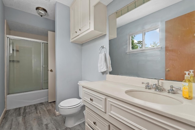 11723 Quail Creek Dr, Houston, TX 77070 - full bath with toilet, wood finished floors, vanity, and baseboards