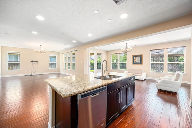 4911 Lattimore Creek Dr, Houston, TX 77084 - kitchen with dishwasher, open floor plan, a sink, a chandelier, and recessed lighting