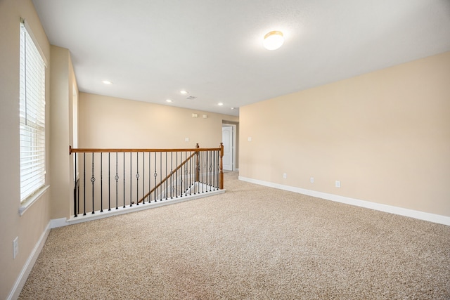 4911 Lattimore Creek Dr, Houston, TX 77084 - carpeted empty room featuring baseboards and recessed lighting