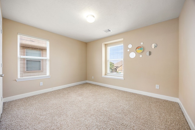 4911 Lattimore Creek Dr, Houston, TX 77084 - carpeted spare room featuring baseboards