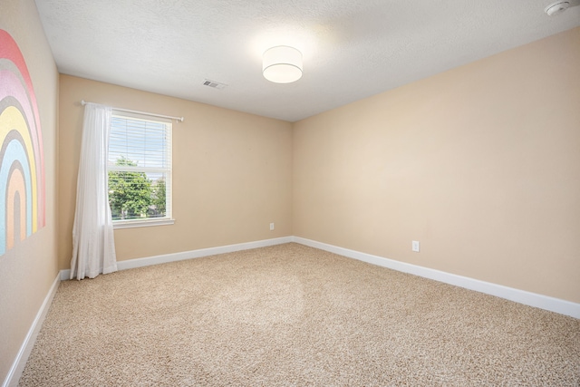 4911 Lattimore Creek Dr, Houston, TX 77084 - spare room with carpet floors, a smoke detector, baseboards, and a textured ceiling