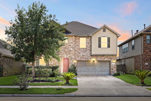 4911 Lattimore Creek Dr, Houston, TX 77084 - traditional-style home featuring driveway, brick siding, and a garage
