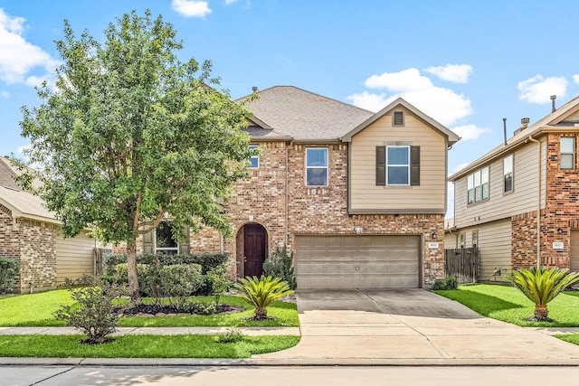 4911 Lattimore Creek Dr, Houston, TX 77084 - view of front of house featuring brick siding, concrete driveway, a garage, and roof with shingles