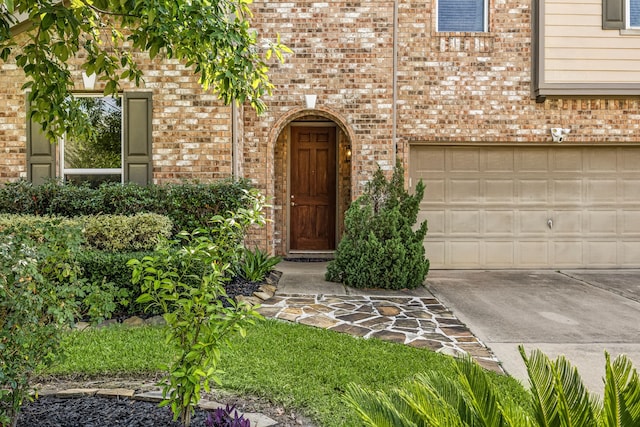 4911 Lattimore Creek Dr, Houston, TX 77084 - doorway to property with driveway, brick siding, and an attached garage