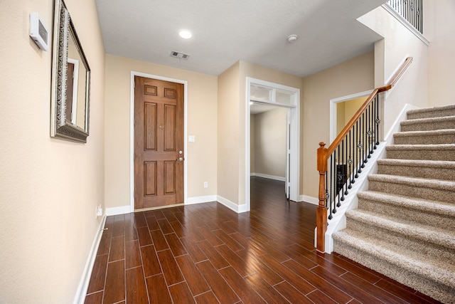 4911 Lattimore Creek Dr, Houston, TX 77084 - entryway featuring baseboards, stairway, and dark wood-style floors
