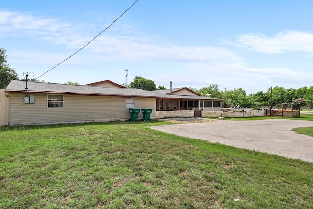 1307 Hillcrest Dr, Granite Shoals, TX 78654 - rear view of house with a lawn