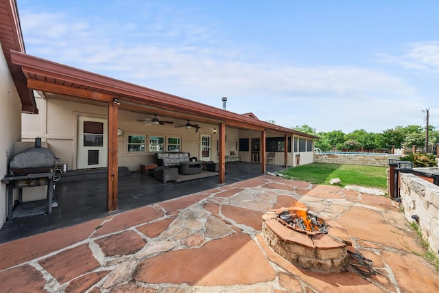 1307 Hillcrest Dr, Granite Shoals, TX 78654 - view of patio / terrace with ceiling fan, an outdoor living space with a fire pit, and a swimming pool