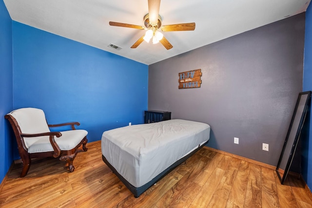 1307 Hillcrest Dr, Granite Shoals, TX 78654 - bedroom featuring wood finished floors, baseboards, and a ceiling fan