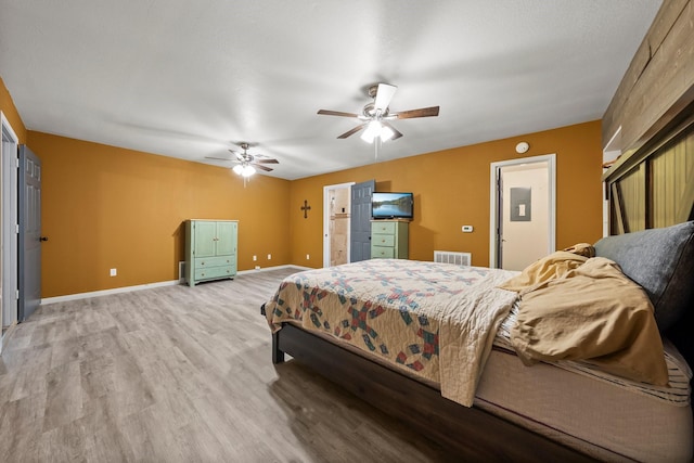 1307 Hillcrest Dr, Granite Shoals, TX 78654 - bedroom featuring baseboards, wood finished floors, and a ceiling fan