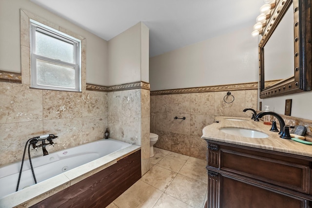 1307 Hillcrest Dr, Granite Shoals, TX 78654 - full bathroom with tile walls, toilet, a wainscoted wall, a tub with jets, and tile patterned floors