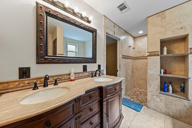 1307 Hillcrest Dr, Granite Shoals, TX 78654 - full bathroom featuring a walk in shower, double vanity, and tile patterned flooring