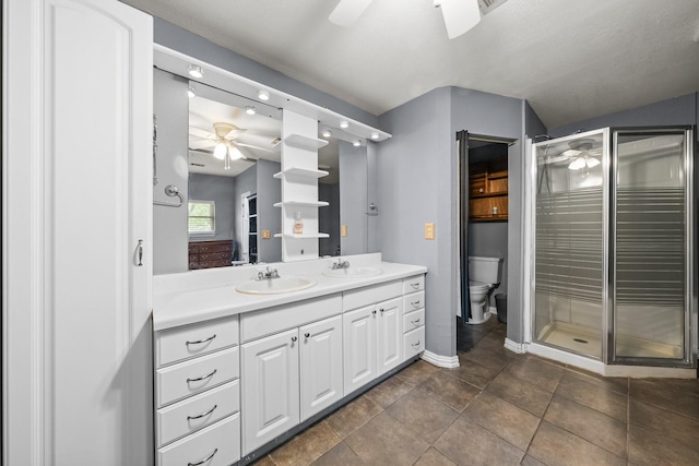 1307 Hillcrest Dr, Granite Shoals, TX 78654 - full bath featuring ceiling fan, a stall shower, toilet, and double vanity