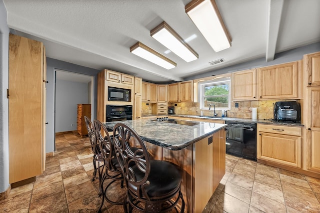 1307 Hillcrest Dr, Granite Shoals, TX 78654 - kitchen featuring black appliances, light brown cabinetry, decorative backsplash, a kitchen bar, and a kitchen island