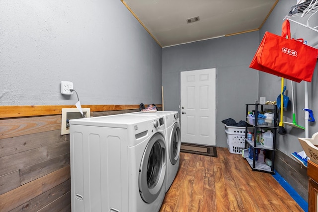 1307 Hillcrest Dr, Granite Shoals, TX 78654 - washroom featuring washing machine and dryer, wood finished floors, and crown molding