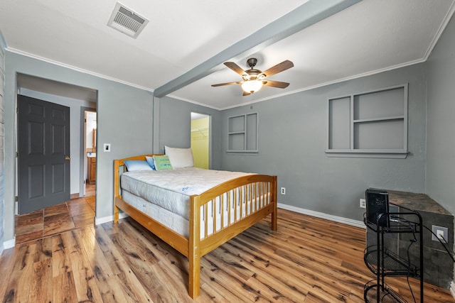 1307 Hillcrest Dr, Granite Shoals, TX 78654 - bedroom featuring crown molding, wood finished floors, baseboards, and a ceiling fan