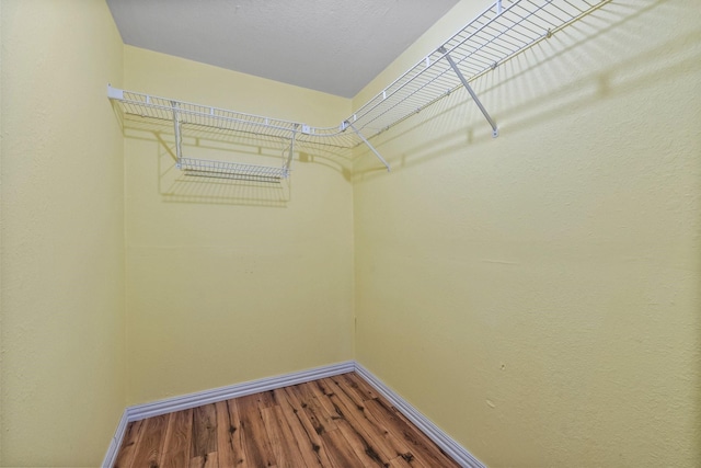 1307 Hillcrest Dr, Granite Shoals, TX 78654 - spacious closet featuring dark wood-style flooring