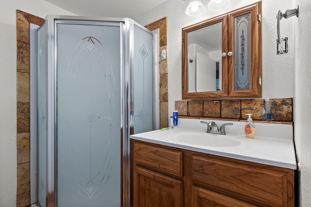 1307 Hillcrest Dr, Granite Shoals, TX 78654 - bathroom with a stall shower, vanity, and a textured wall