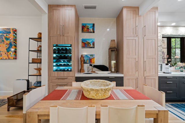 10 S Briar Hollow Ln Unit 30, Houston, TX 77027 - dining space featuring light wood-style floors and ornamental molding