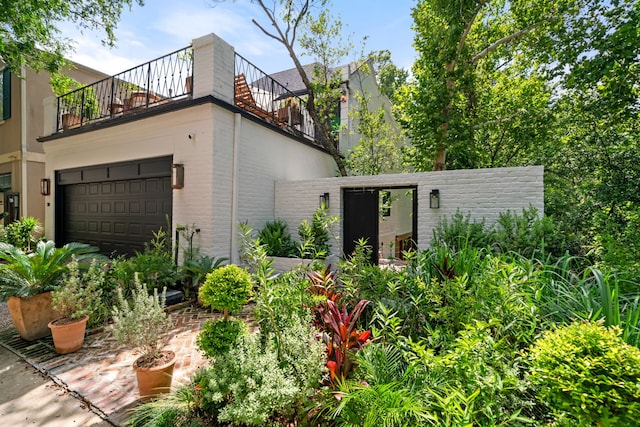 10 S Briar Hollow Ln Unit 30, Houston, TX 77027 - view of front of property featuring a balcony and a garage