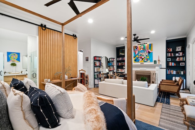 10 S Briar Hollow Ln Unit 30, Houston, TX 77027 - living room featuring ceiling fan, light wood-type flooring, crown molding, recessed lighting, and a barn door