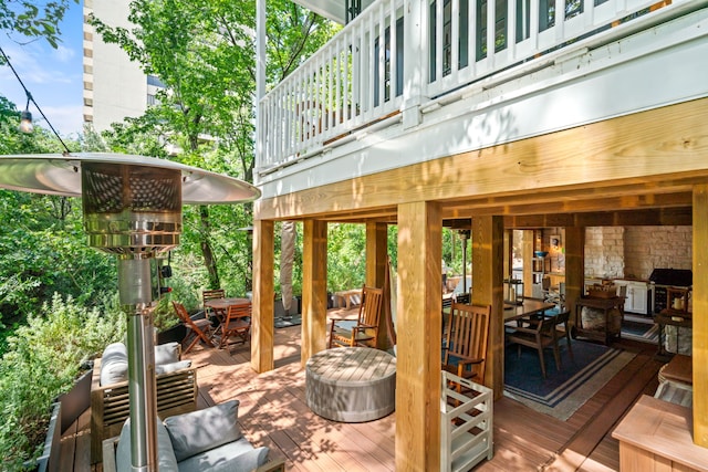 10 S Briar Hollow Ln Unit 30, Houston, TX 77027 - wooden deck with outdoor dining area