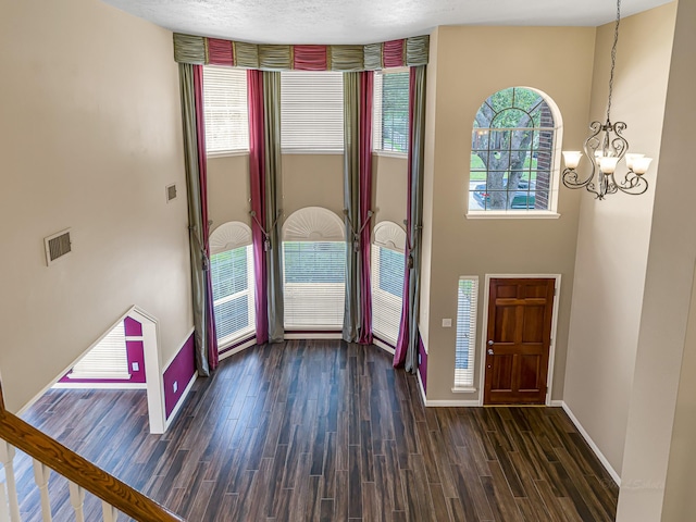 15510 Tysor Park Ln, Houston, TX 77095 - entrance foyer with wood finished floors, a chandelier, and baseboards