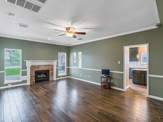 15510 Tysor Park Ln, Houston, TX 77095 - unfurnished living room featuring ceiling fan, a textured ceiling, plenty of natural light, dark wood finished floors, and baseboards