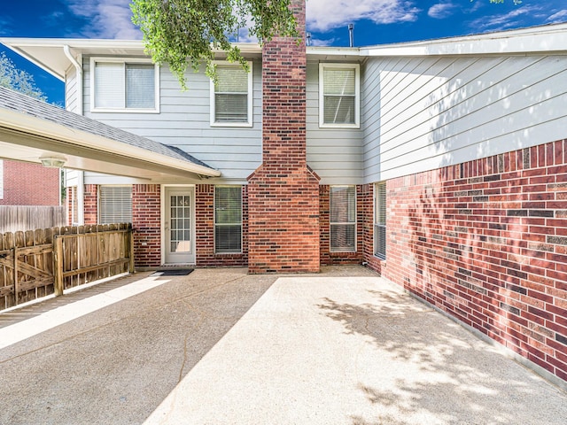 15510 Tysor Park Ln, Houston, TX 77095 - back of house with brick siding and a patio