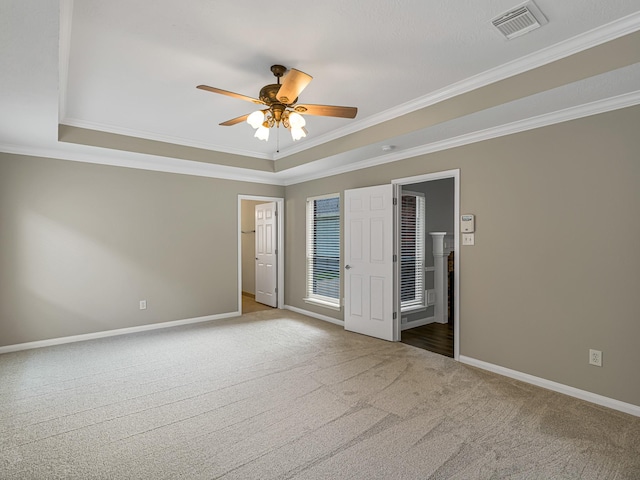 15510 Tysor Park Ln, Houston, TX 77095 - unfurnished bedroom with a tray ceiling, carpet flooring, ornamental molding, and baseboards
