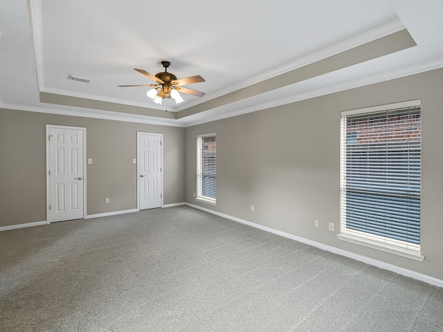 15510 Tysor Park Ln, Houston, TX 77095 - carpeted empty room featuring a tray ceiling, ceiling fan, crown molding, and baseboards