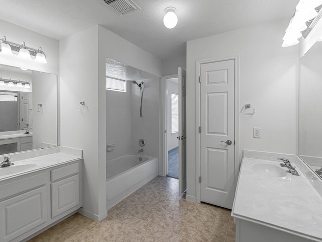 15510 Tysor Park Ln, Houston, TX 77095 - full bath with shower / tub combination, two vanities, and a textured ceiling