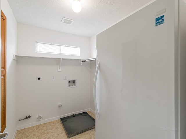 15510 Tysor Park Ln, Houston, TX 77095 - laundry area with hookup for a gas dryer, hookup for a washing machine, hookup for an electric dryer, a textured ceiling, and baseboards