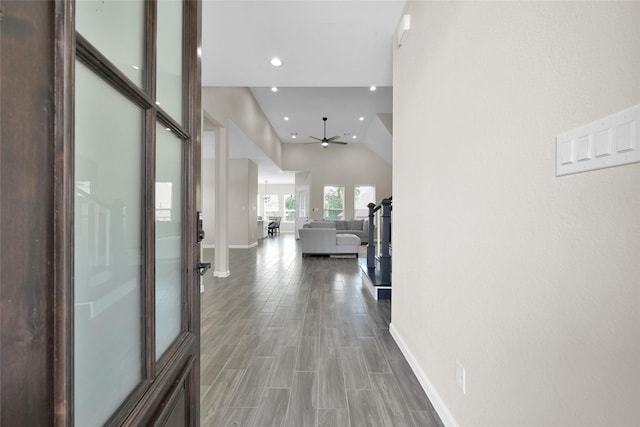 40380 Mostyn Dr, Magnolia, TX 77354 - hallway with baseboards, recessed lighting, wood finished floors, and lofted ceiling
