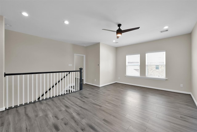 40380 Mostyn Dr, Magnolia, TX 77354 - empty room featuring wood finished floors, ceiling fan, baseboards, and recessed lighting