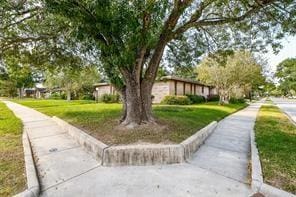 5502 Dumfries Dr, Houston, TX 77096 - view of home's community with a yard