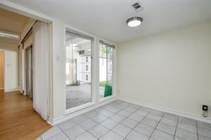 5502 Dumfries Dr, Houston, TX 77096 - unfurnished room with light tile patterned flooring and baseboards