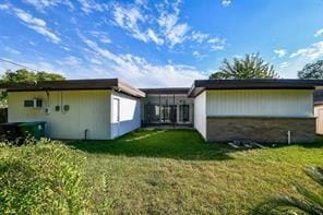 5502 Dumfries Dr, Houston, TX 77096 - rear view of house with a yard