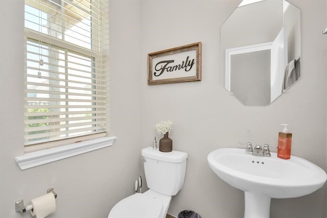 3519 Rossini Dr, Katy, TX 77493 - half bath with healthy amount of natural light, toilet, and a sink